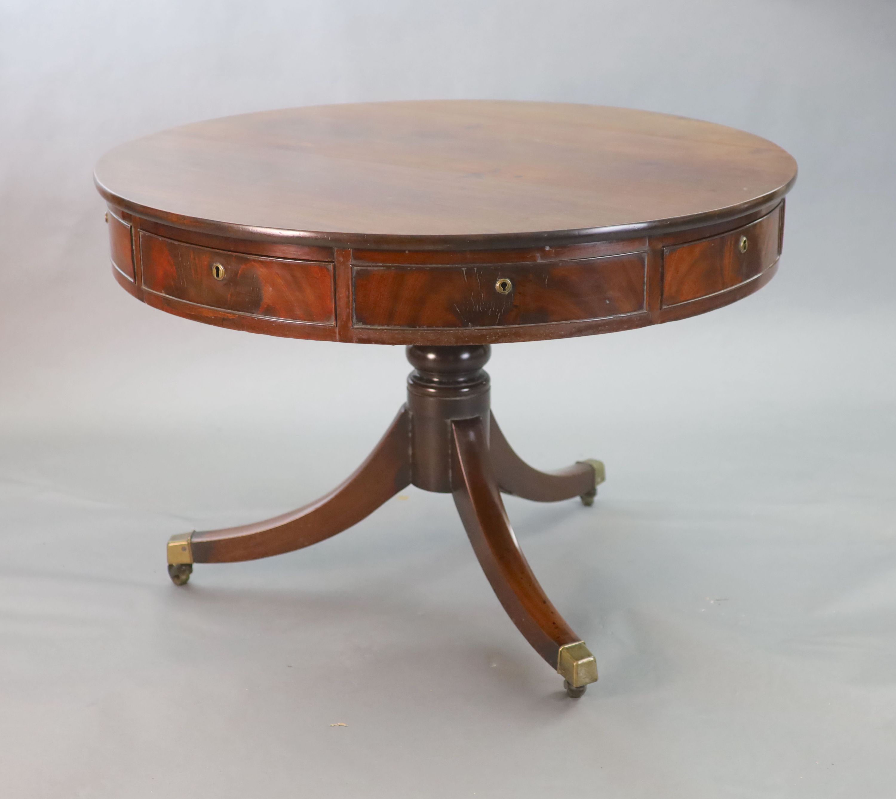A Regency mahogany drum top library table,